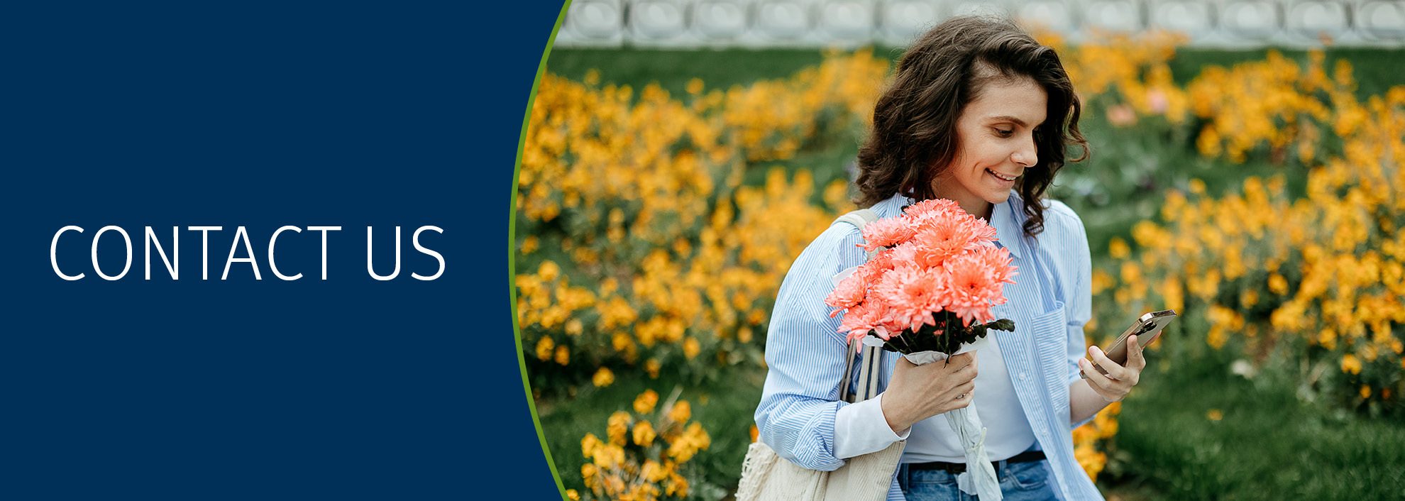 Contact Us; Image of woman sitting outside surrounded by flowers holding a bouquet